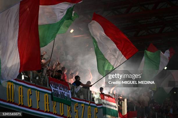 Hungary's fans wave their country's national flag during the UEFA Nations League - League A, Group 3 first leg football match between Italy and...