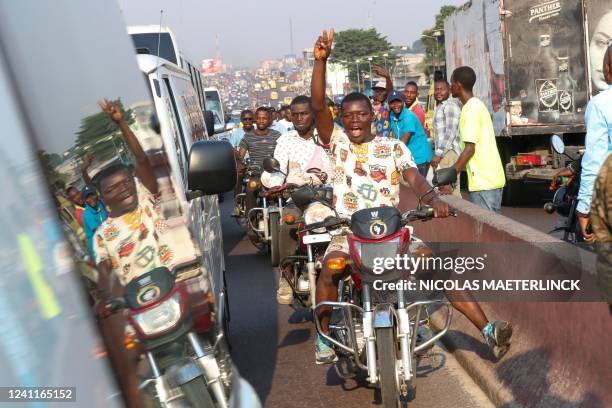 Congolese citizens welcome the Royals at their arrival for an official visit of the Belgian Royal couple to the Democratic Republic of Congo, Tuesday...