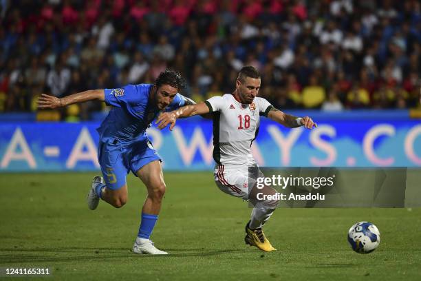 Zsolt Nagy , of Hungary, is challenged by Davide Calabria , of Italy, during the UEFA Nations League football match between Italy and Hungary at the...