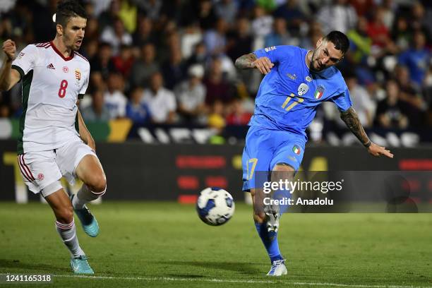 Matteo Politano , of Italy, kicks the ball as he is challenged by Adam Nagy , of Hungary, during the UEFA Nations League football match between Italy...