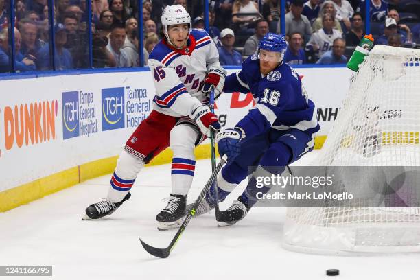Riley Nash of the Tampa Bay Lightning skates against Braden Schneider of the New York Rangers during the first period in Game Four of the Eastern...
