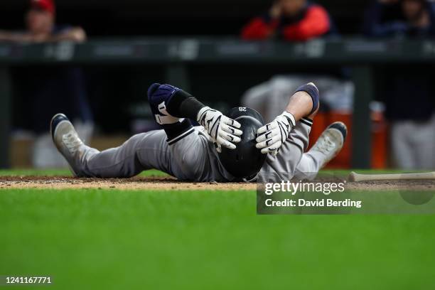 Josh Donaldson of the New York Yankees lays on the ground after a high pitch in the ninth inning of the game against the Minnesota Twins at Target...