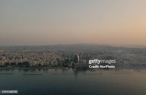 View of the Oval Office Complex in the center in a light haze at dawn in the Mediterranean port of Limassol. Cyprus, Wednesday, June 8th, 2022.