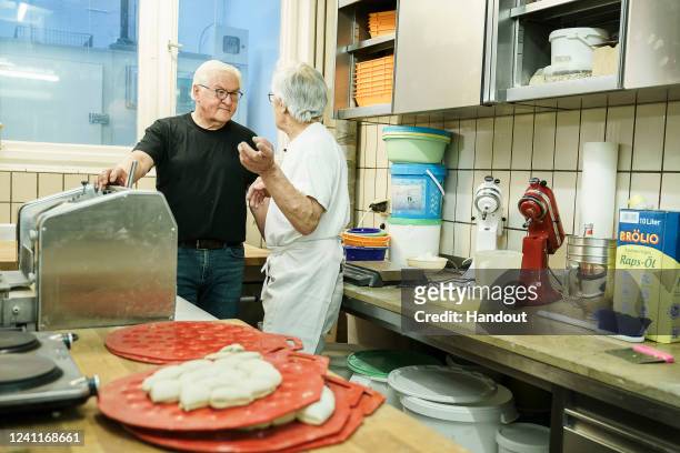 In this handout photo provided by the German Government Press Office , Federal President Frank-Walter Steinmeier visits the bakery Mink during his...