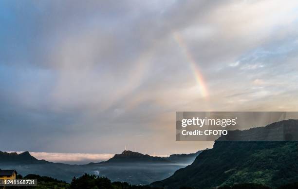 Rows of wind turbines rotate on a mountaintop in Chongqing, China, On June 8, 2022. In recent years, Nanchuan District of Chongqing has accelerated...