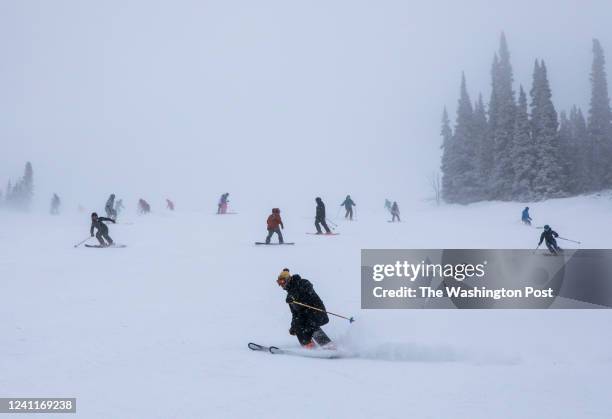 Skiers and snowboarders ride fresh snow at Jackson Hole Mountain Resort on Dec. 11, 2021 in Teton Village, Wyo.