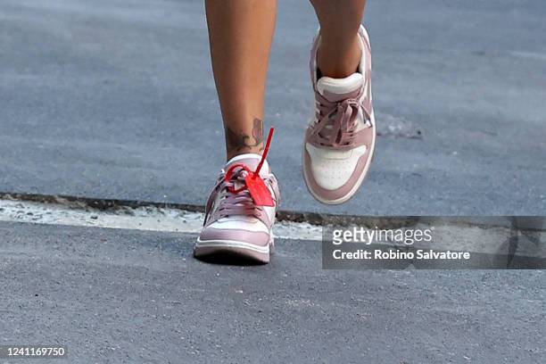 Belen Rodriguez is seen wearing Off White sneakers on June 7, 2022 in Milan, Italy.
