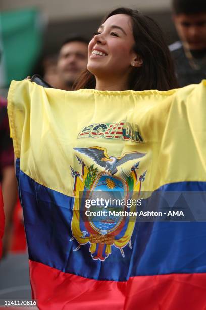 Female fan holding the flag of Ecuador during an International Friendly game between Mexico and Ecuador at Soldier Field on June 5, 2022 in Chicago,...