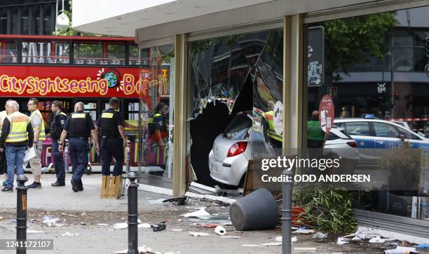 The car that was driven into a group of people killing one person and injuring eight injured is pictured in central Berlin, on June 8, 2022. - A...