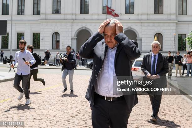 Former UEFA president Michel Platini leaves Switzerland's Federal Criminal Court after the first day of his trial over a suspected fraudulent payment...