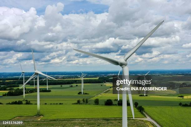 An aerial view shows wind turbines near the city of Warstein, western Germany, on June 8, 2022.