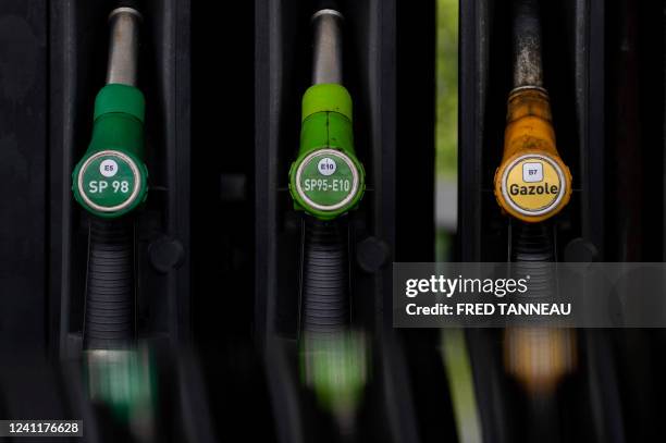 This picture taken on June 8, 2022 shows gasoline nose units at a petrol station in Quimper, Brittany, western France, as gasoline prices reached...