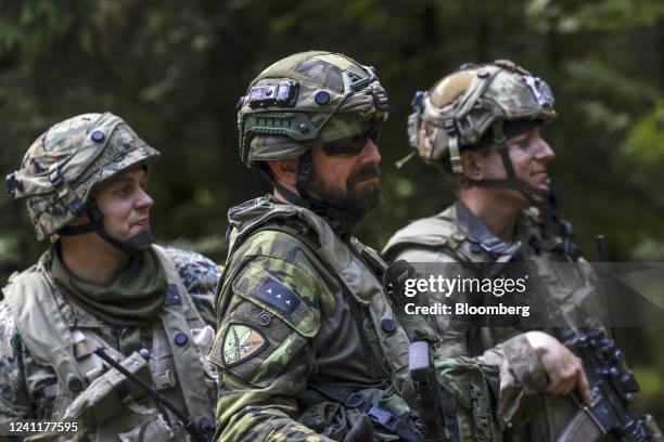 Czech Army, left, a Bosnian Army, center, and US Army soldier during the Combined Resolve 17 multinational training exercise, with participating...