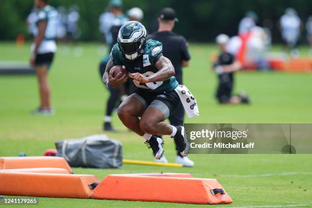 Miles Sanders of the Philadelphia Eagles jumps over a pad during OTAs at the NovaCare Complex on June 8, 2022 in Philadelphia, Pennsylvania.