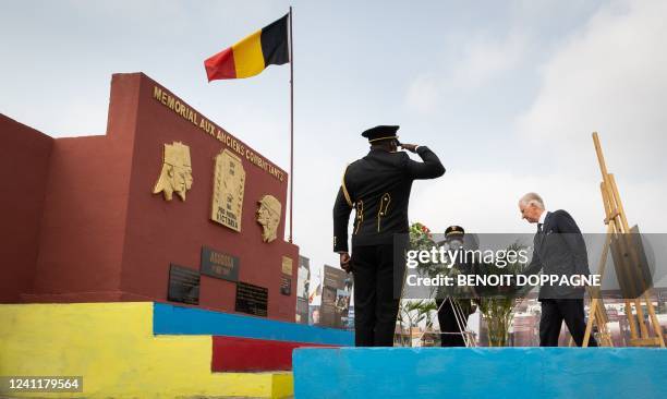 King Philippe - Filip of Belgium stands still at a wreath laying at the 'Memorial aux anciens combattants', in Kinshasa, during an official visit of...