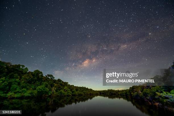 View of the night sky illuminating the Manicore river, located in the municipality of Manicore, Amazonas state, Brazil, in the Amazon rainforest, on...