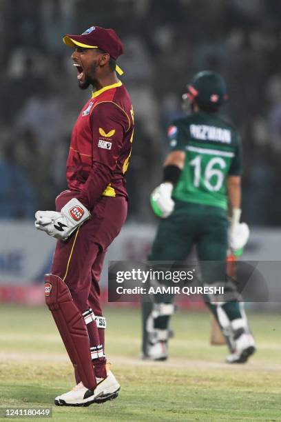 West Indies' captain wicketkeeper Nicholas Pooran celebrates after the dismissal of Pakistan's Mohammad Rizwan during the first one-day international...