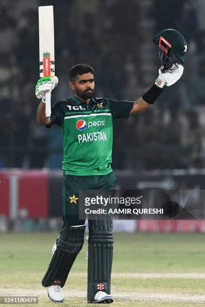 Pakistan's captain Babar Azam celebrates after scoring a century during the first one-day international cricket match between Pakistan and West...