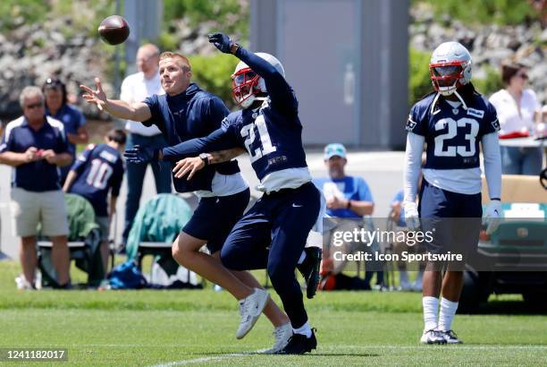 New England Patriots safety Adrian Phillips performs in a pass breakup drill as safety Kyle Dugger waits his turn during Day 2 of mandatory New...