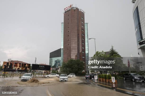 The drivers face heavy rains and flooded streets that disrupted the city in Ankara, Turkiye on June 08, 2022.