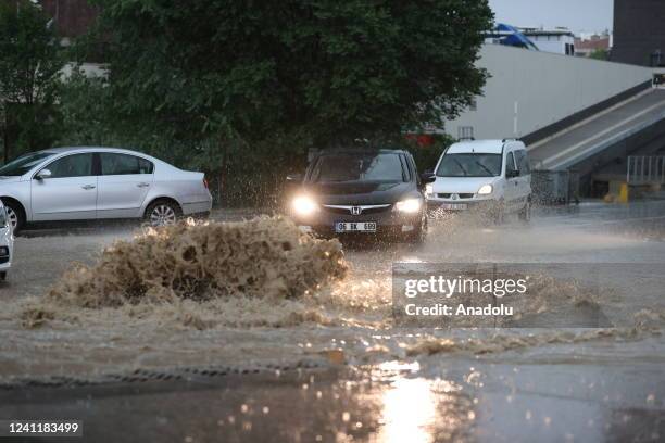 The drivers face heavy rains and flooded streets that disrupted the city in Ankara, Turkiye on June 08, 2022.