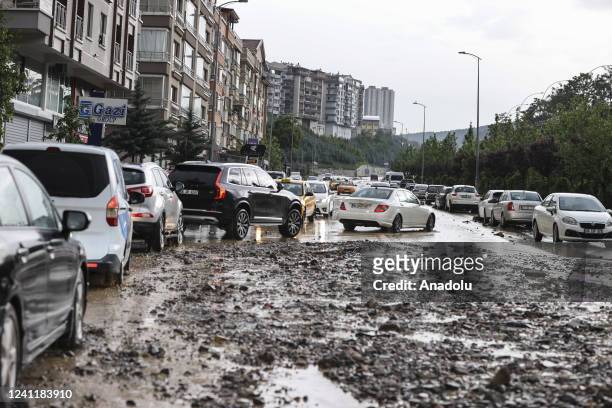 The drivers face heavy rains and damaged roads that disrupted the city in Ankara, Turkiye on June 08, 2022.