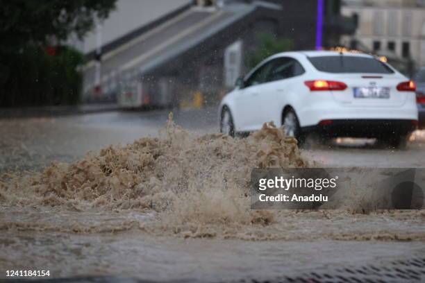 The drivers face heavy rains and flooded streets that disrupted the city in Ankara, Turkiye on June 08, 2022.