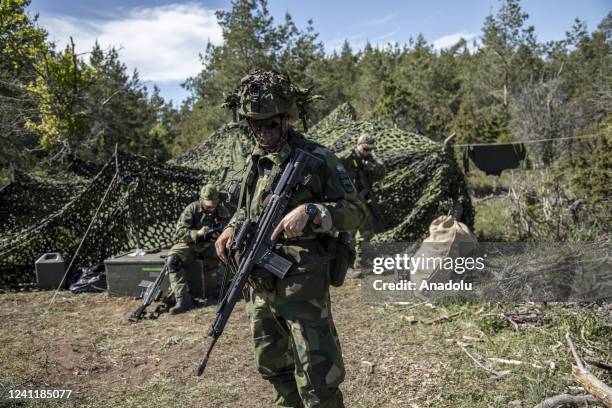 Volunteer members of the Home Guard battalion of Gotland are seen on a military camp in a location near by Hejdeby as they work securing the area,...