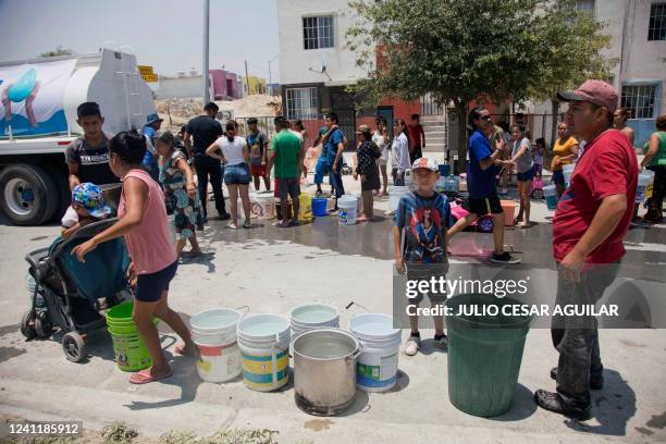 Residents queue to collect clean water from a tanker truck in Garcia municipality, northwest of the Monterrey metropolitan area, Nuevo Leon State,...