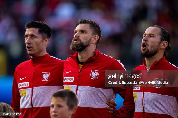 Robert Lewandowski, Bartlomiej Dragowski, Grzegorz Krychowiak of Poland singing national anthem during the UEFA Nations League League A Group 4 match...