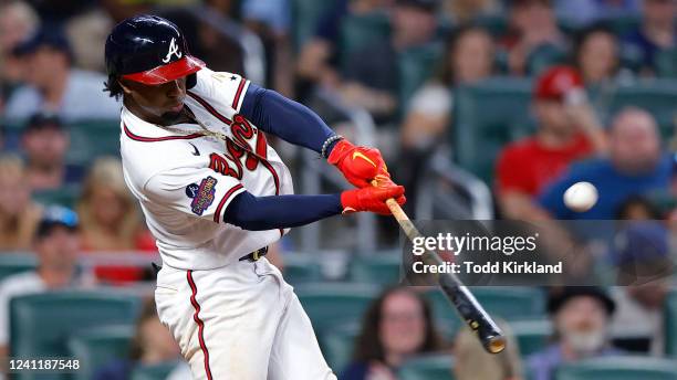 Ozzie Albies of the Atlanta Braves hits a three-run home run during the seventh inning against the Oakland Athletics at Truist Park on June 8, 2022...