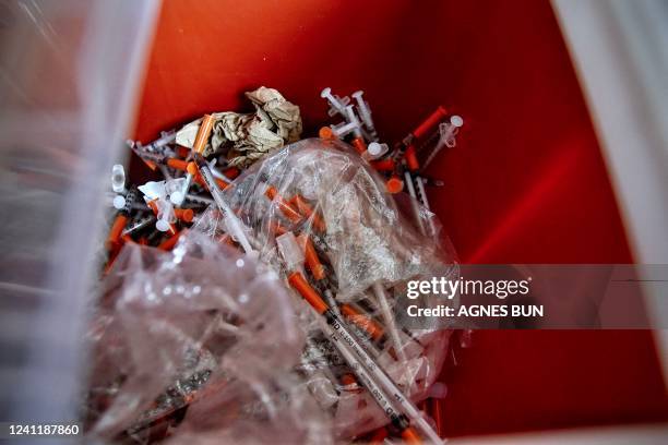 Used syringes, collected by the staff of the Family and Medical Counselling Service Inc , sit in a container inside the FMCS van in Washington, DC,...