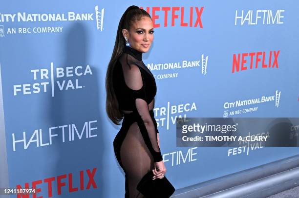 Singer-actress Jennifer Lopez arrives for the premiere of "Halftime" on opening night of the Tribeca Festival at the United Palace in New York, June...