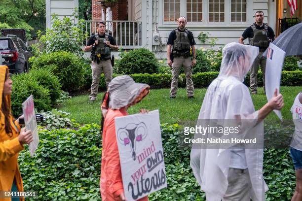 Protesters march past Supreme Court Justice Brett Kavanaugh's home on June 8, 2022 in Chevy Chase, Maryland. An armed man was arrested near...
