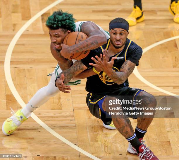 Marcus Smart of the Boston Celtics steals the ball from Gary Payton II of the Golden State Warriors during the second half of Game Three of the 2022...