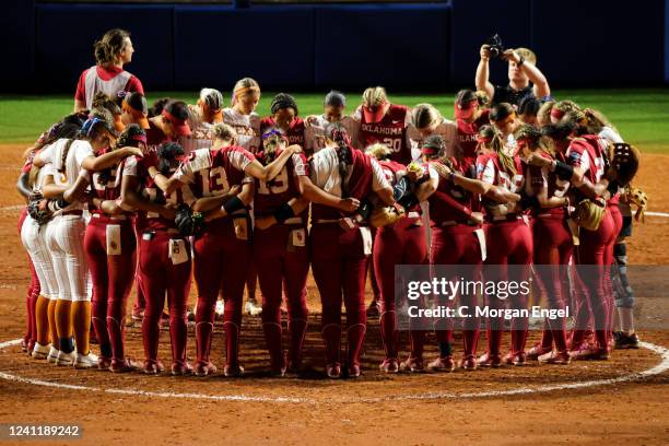 The Texas Longhorns and Oklahoma Sooners gather at the pitching circle after the game during the Division I Womens Softball Championship held at ASA...