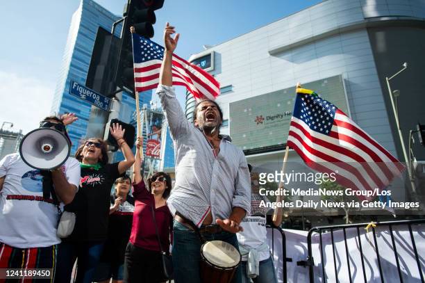 Omar Gomez, of Colorado, center, joins a protest for immigration reform outside Summit of the Americas at the Los Angeles Convention Center in Los...