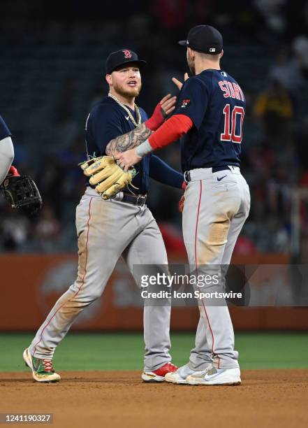 Boston Red Sox left fielder Alex Verdugo celebrates with second baseman Trevor Story on the field after the Red Sox defeated the Los Angeles Angels 1...