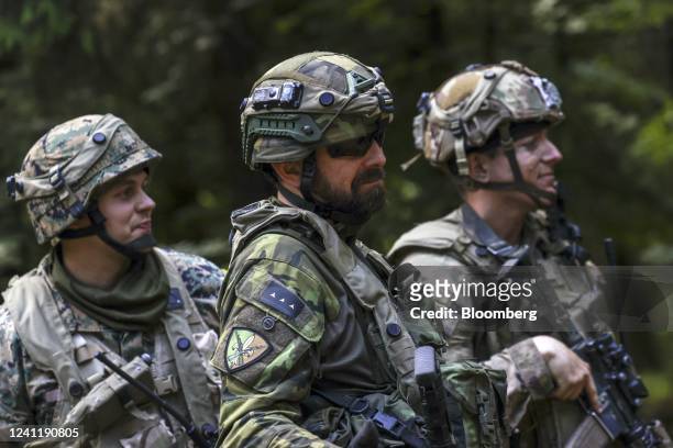 Czech Army, left, a Bosnian Army, center, and US Army soldier during the Combined Resolve 17 multinational training exercise, with participating...