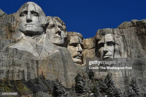 The U.S. Presidents from left George Washington, Thomas Jefferson, Theodore Roosevelt and Abraham Lincoln carved into the mountain at Mount Rushmore...