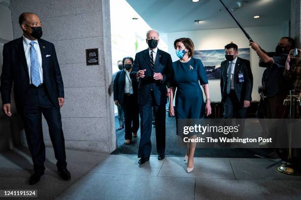 Sergeant at Arms of the House of Representatives William Walker, left watches as President Joe Biden and House Speaker Nancy Pelosi of Calif., depart...