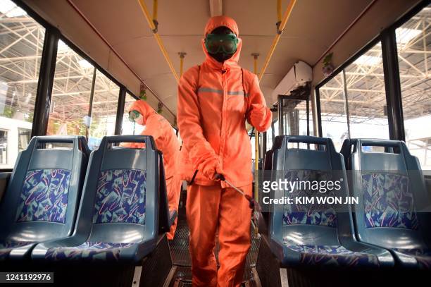 Health officiasl of the Ryonmot Trolley Bus Office disinfect a trolley bus, as part of preventative measures against the Covid-19 coronavirus in...