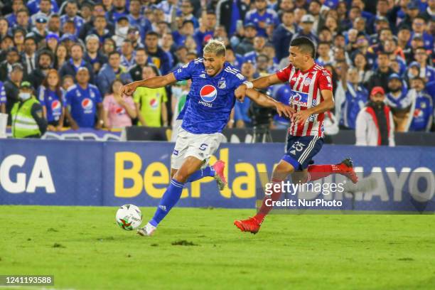 Carlos Esparragoza of Junior and Larry Vasquez of Millonarios fight for the ball during the match on matchday 4 of the quadrangular semifinals of the...