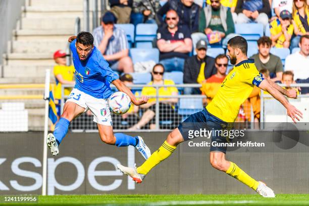 Nicolò Cambiaghi of Italy competes for the ball with Aiham Ousou of Sweden during the UEFA European Under-21 Championship Qualifier Group F match...