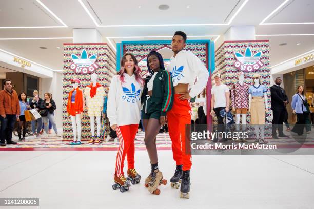 Roller skater, model and influencer Oumi Janta with her co-skaters pose after their performance during Germany's one and only adidas x Gucci Pop-up...