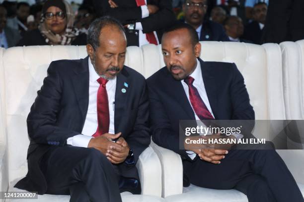 Somalia's new President Hassan Sheikh Mohamud speaks with Ethiopia's Prime Minister Abiy Ahmed during his inauguration calemony as the 10th President...