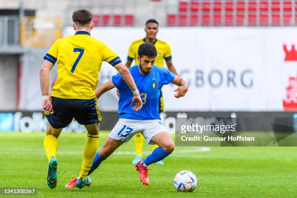 Patrik Wålemark of Sweden competes for the ball with Fabiano Parisi of Italy during the UEFA European Under-21 Championship Qualifier Group F match...
