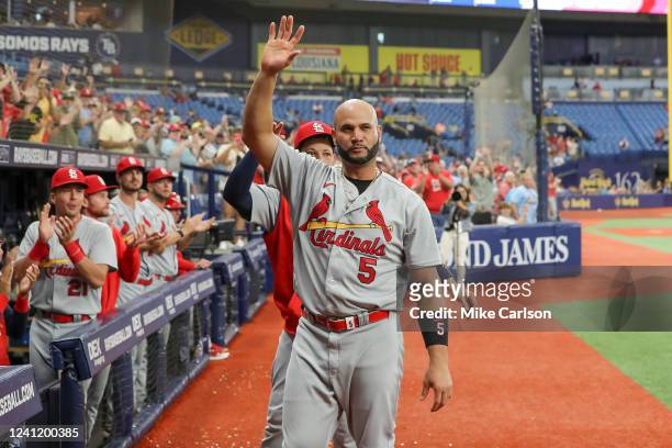Albert Pujols of the St. Louis Cardinals and Yadier Molina acknowledge the crowd after a video tribute from the Tampa Bay Rays during a baseball game...