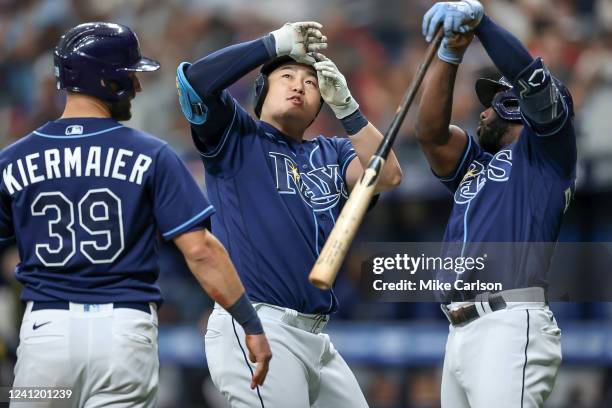 Ji-Man Choi of the Tampa Bay Rays, center, celebrates his home run against the St. Louis Cardinals with Kevin Kiermaier and Manuel Margot during the...