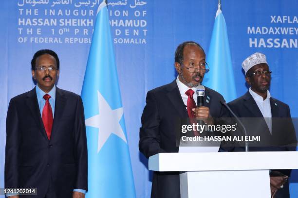 Somalia's new President Hassan Sheikh Mohamud speaks with former President Mohamed Abdullahi Mohamed and former President Sharif Sheikh Ahmed during...